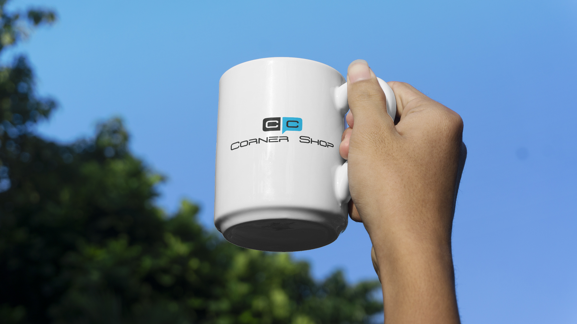 a person holding a Cash Corner cup.