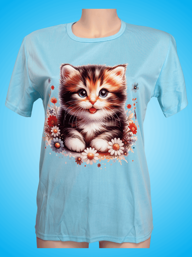charming female blue t-shirt with a happy baby cat that smile in the center of a shirt, surrounded by flowers.