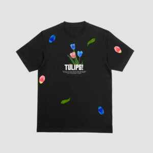FRONT VIEW OF THE BLACK T-SHIRT WITH A VIBRANT MIXED TULIPS PRINT AND PETALS ON IT.