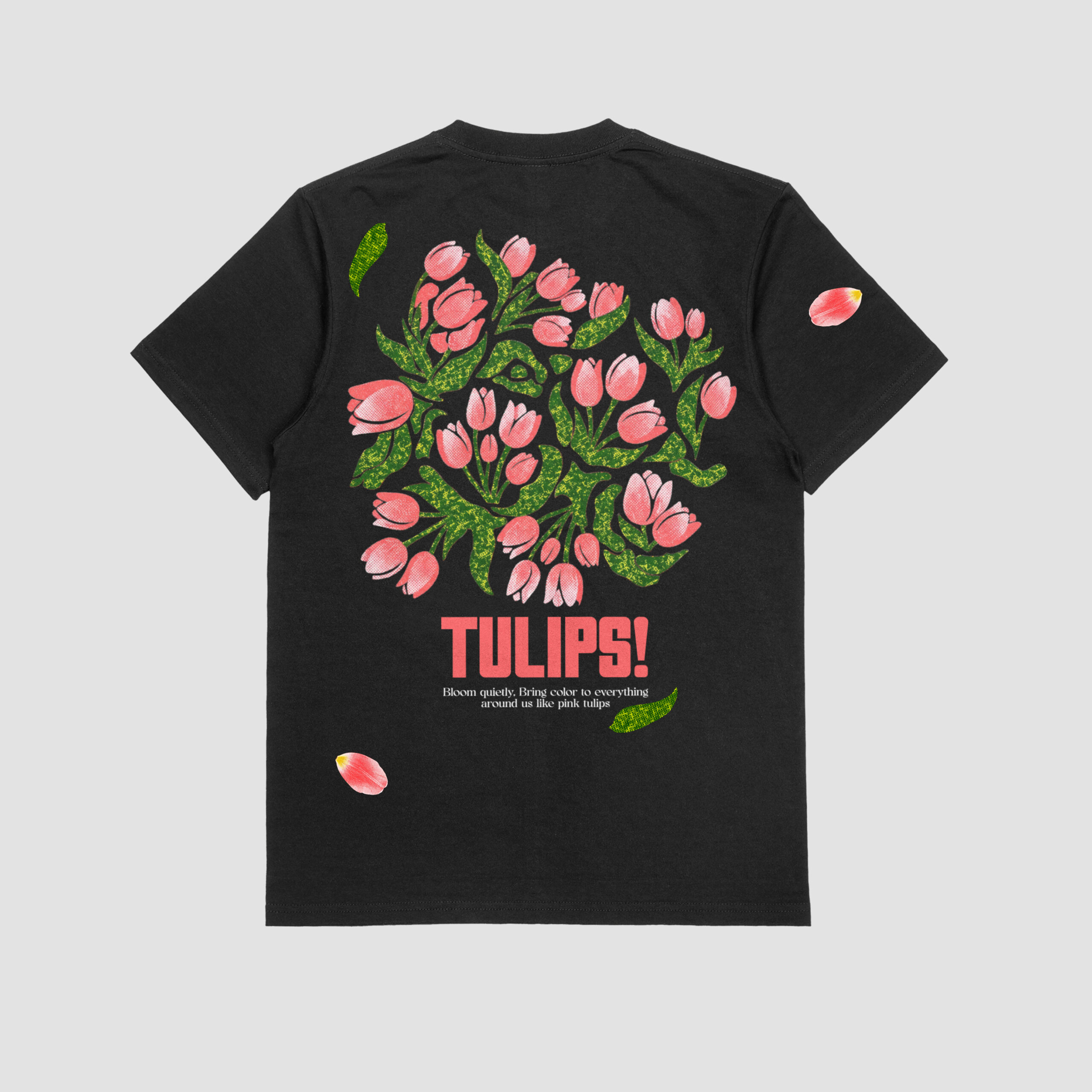 BACK VIEW OF THE BLACK T-SHIRT WITH THE PRINT OF A BUNCH OF VIBRANT PINK TULIPS.