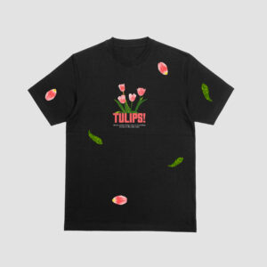 FRONT VIEW OF THE BLACK T-SHIRT WITH A VIBRANT PINK TULIPS PRINT AND PETALS ON IT.