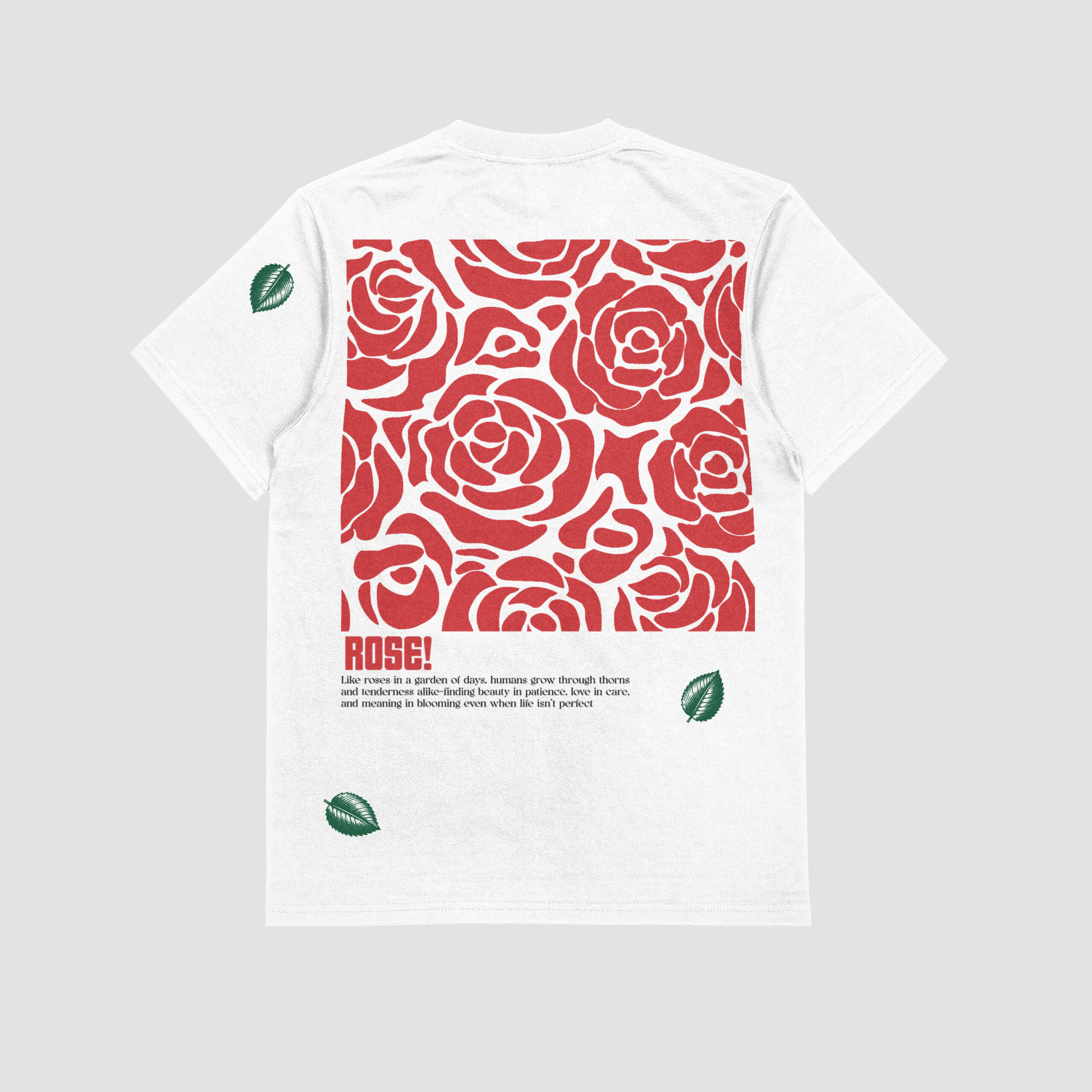 BACK VIEW OF THE WHITE T-SHIRT WITH THE PRINT OF A BUNCH OF VIBRANT RED ROSES.